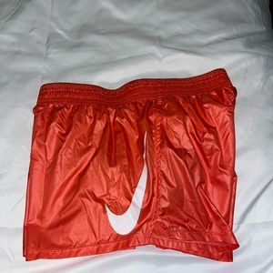 Orange Nike athletic shorts